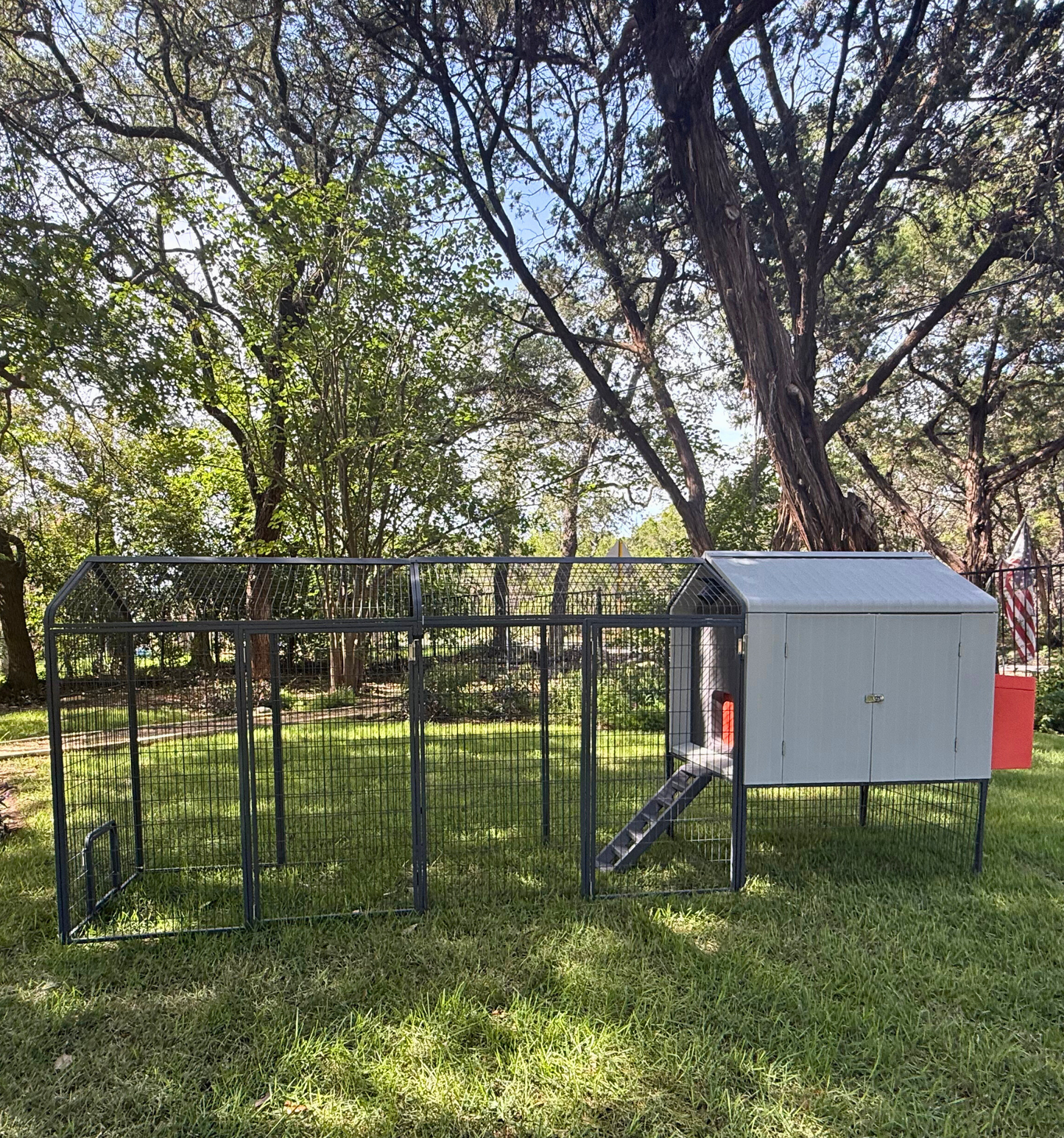 Extended Range Chicken Run Extension attached to Smart Coop creating expanded secure outdoor enclosure