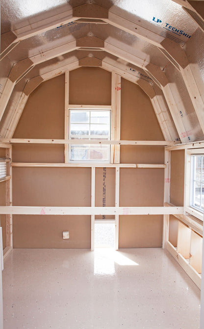 Interior view of a 4x4 chicken coop featuring a grey epoxy floor for easy cleaning and a large window for natural light.