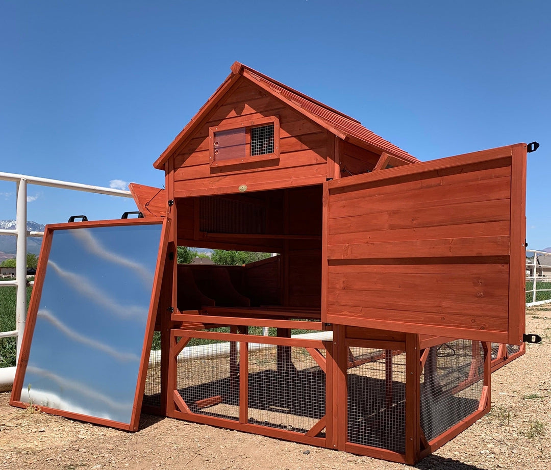 Wooden chicken coop with an open door in an outdoor setting