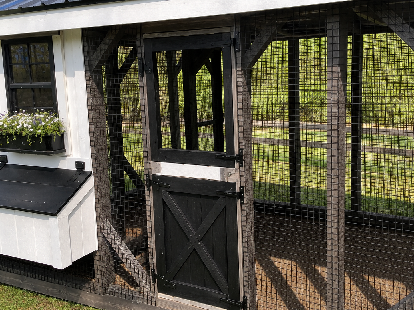 Close-up of black Dutch door and heavy-duty wire run on a premium 7x20 custom chicken coop.