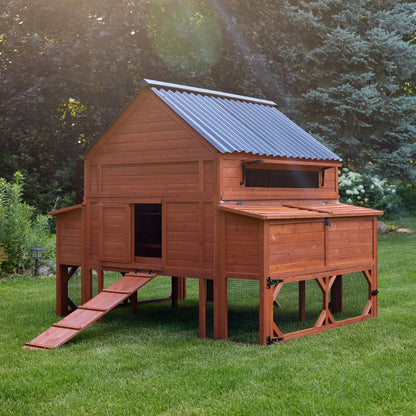  Side angle view of Brahma chicken coop showing entry ramp, raised hen house, and attached enclosed run on grass