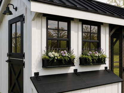 Close-up of black windows with flower boxes on a white LP siding custom chicken coop with farmhouse styling.
