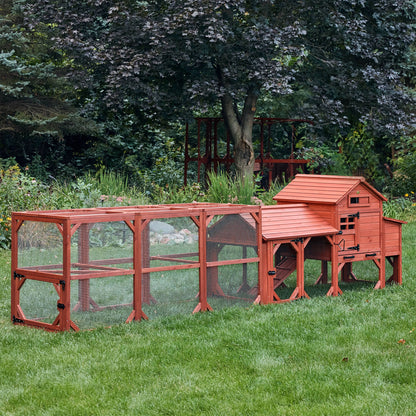 Leghorn Cottage small backyard chicken coop fully assembled in lush garden setting showing natural wood finish and complete run configuration