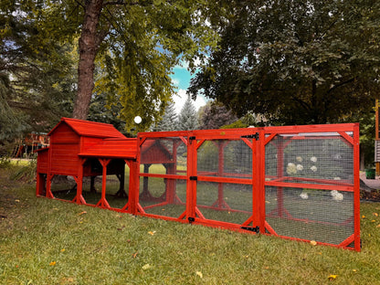 Side angle view of Leghorn Cottage chicken coop showing full run length, hen house elevation, and complete kit assembly in outdoor setting
