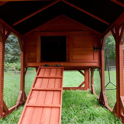 Close-up of Leghorn Cottage chicken coop hen house showing entry ramp, sliding door handle, and raised floor clearance underneath