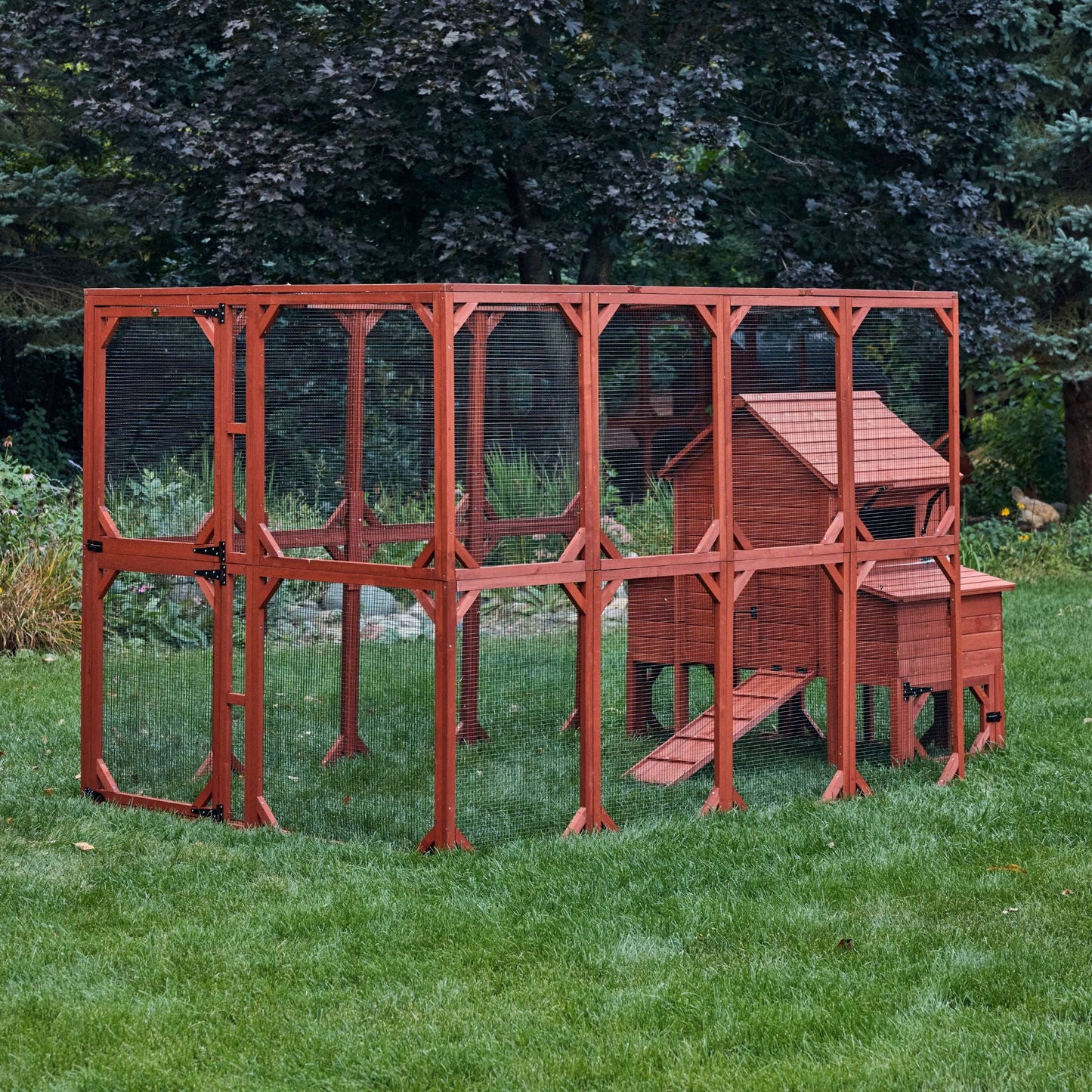 Side view of Orpington Lodge chicken coop and run extension assembled outdoors showing full run length and hen house elevation

